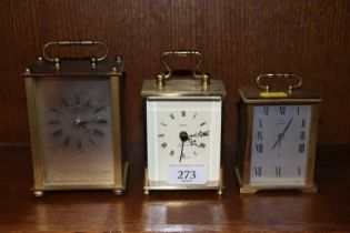 Three carriage style mantel clocks