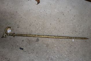An unusual brass hollow walking stick