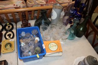 A collection of various glass decanters, decanters