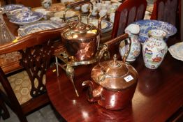Two antique copper kettles; and a brass hearth sta
