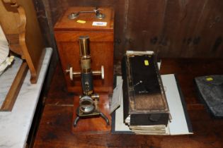 A mahogany cased microscope and a box of miscellan