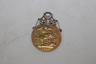A 1911 Sovereign in yellow metal mount, approx. to