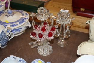 A pair of crystal candlesticks and a floral form dec