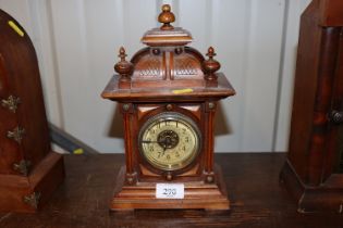 A late 19th Century walnut cased mantel timepiece