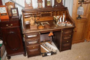 An oak roll top desk