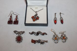 A collection of 925 silver and other amber set jew