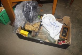 A box containing old glass bottles, cash tin, adve