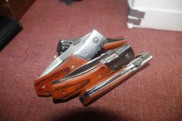 Four folding pocket knives (11)