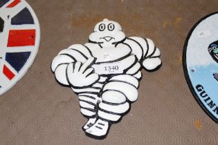 A reproduction cast iron Michelin man plaque (189)