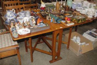 A teak drop leaf table