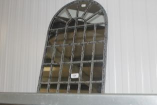 A metal framed wall mirror (146)