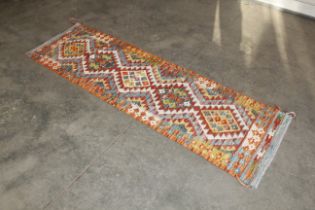 An approx. 6'9" x 2' Chobi Kilim runner