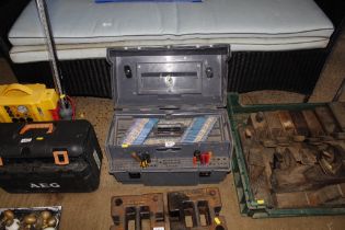 A plastic tool box and contents