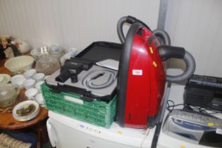 A Miele vacuum cleaner and accessories