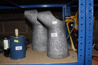 Two galvanised jugs (30)