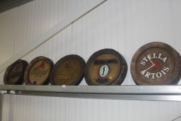 A Stella advertising wall clock and four reproduct