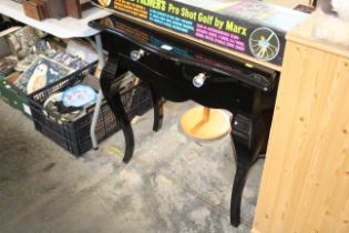 A serpentine front table fitted two drawers