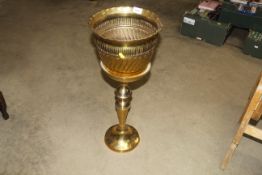 A brass jardinière and stand
