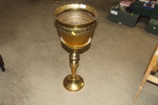 A brass jardinière and stand