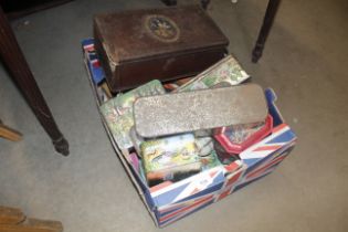 A box of advertising tins