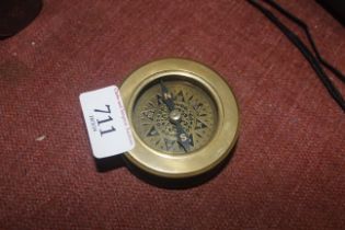 A reproduction brass combined compass and magnifying glass (90)
