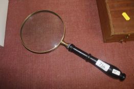 A large magnifying glass (163)