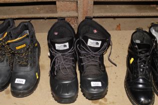 A pair of North Face boots size 10