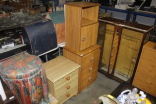 A bedside cupboard and two three drawer bedside ch