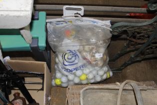 A bag of various golf balls