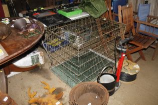 A metal pet cage with floor cushion