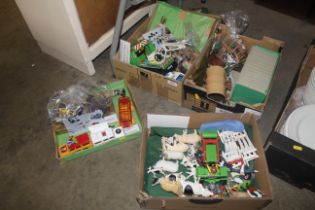 Four boxes of Playmobil and other toys including a