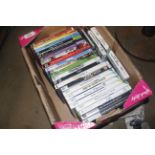 A box containing an Nintendo Wi, PlayStation and PC games