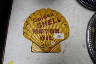 A reproduction "Golden Shell Motor Oil" sign