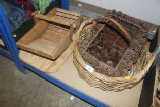 A wooden trug, chopping board and two wicker baske