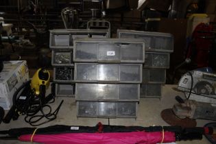 Three plastic chests and contents of various nuts