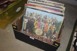 A box of records to include The Beatles, Genesis, Elton John etc.