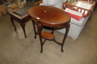 A mahogany oval window table