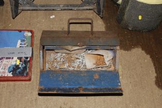 A metal tool box and contents of various fittings