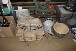 A galvanised watering can, a glazed planter, a wic