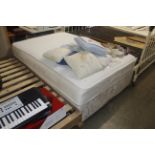 A double divan bed with Sealy mattress