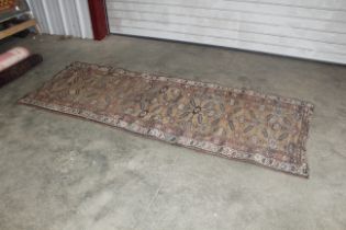 An approx. 9' x 3'6" Eastern patterned runner AF