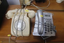 A Binatone telephone and a rotary dial telephone