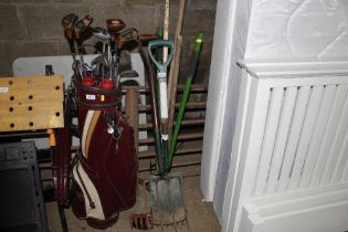 A bundle of long handled gardening tools to includ