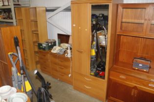 An Alstons bedroom suite comprising mirrored door wardrobe; three drawer dressing chest, and three