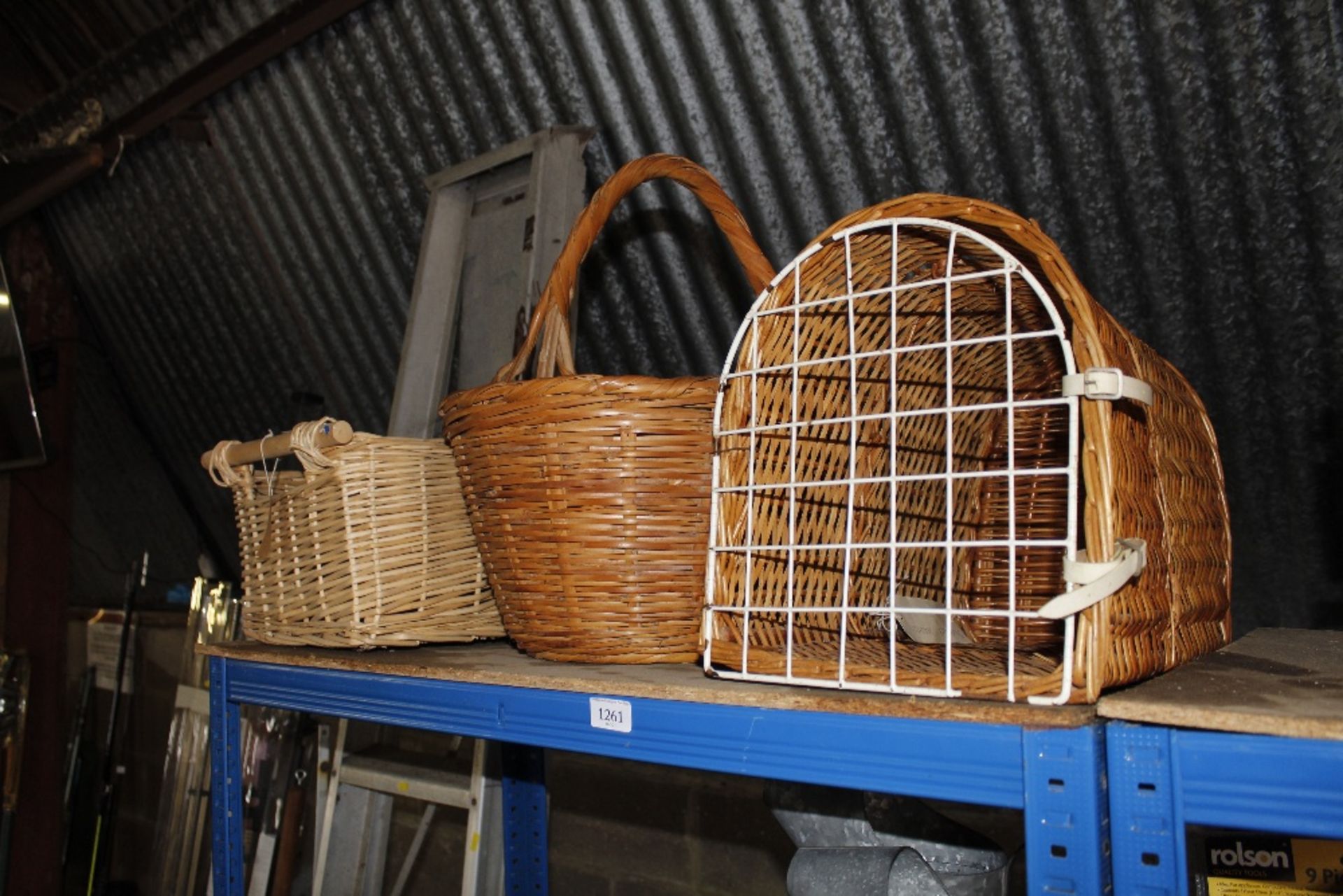 Two wicker baskets and a wicker pet basket
