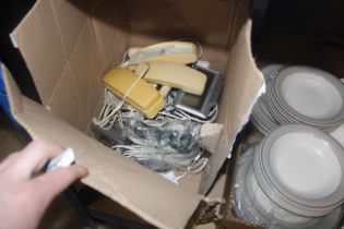 A box of old telephones etc.