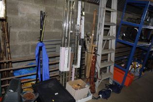 A quantity of various curtain rings, curtain poles