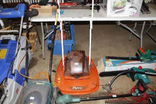 A Flymo petrol hover mower