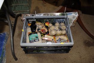 A plastic crate containing various fat balls and b