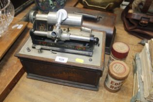A Graphophone Phonograph (no horn) and two wax cylinders